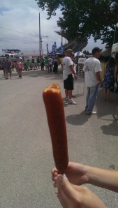 This beauty is called corn dog. It's fried sausage and tastes horrible. But hey, it's on a stick!